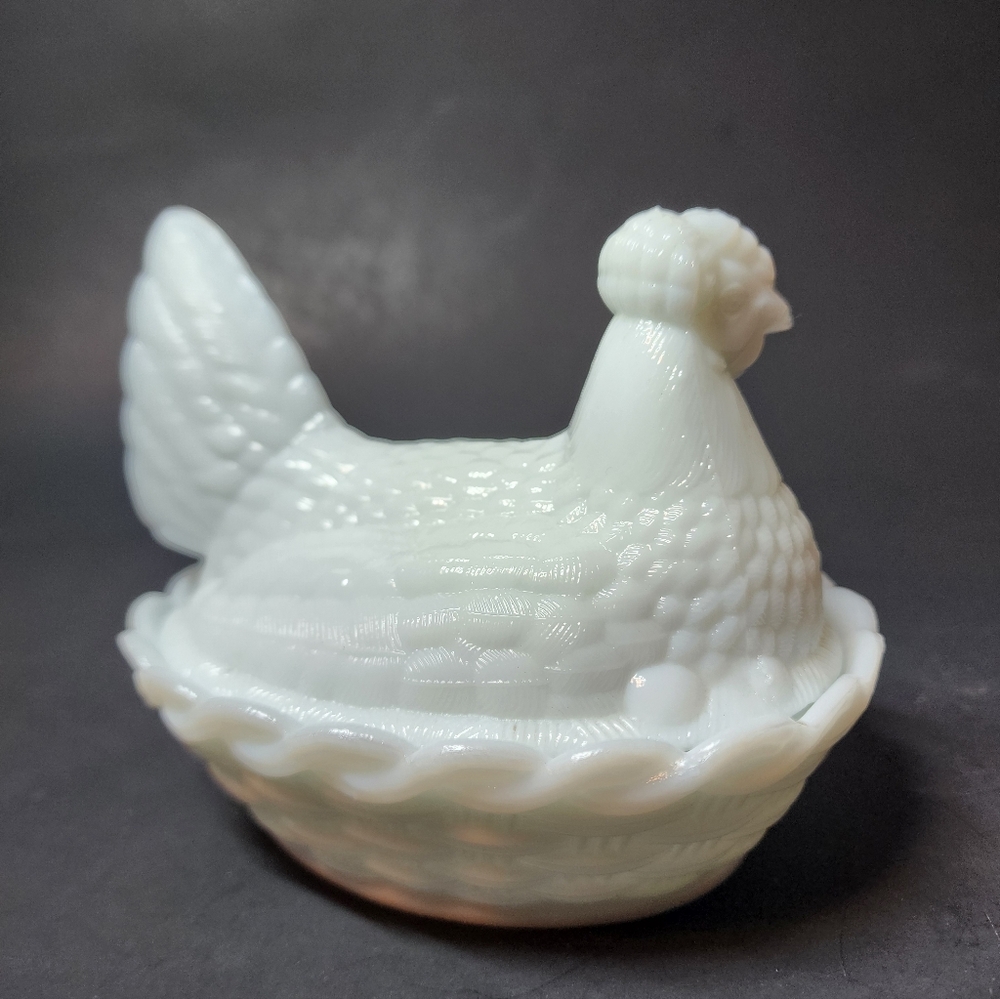 Vintage white milk glass egg holding hen on nest
